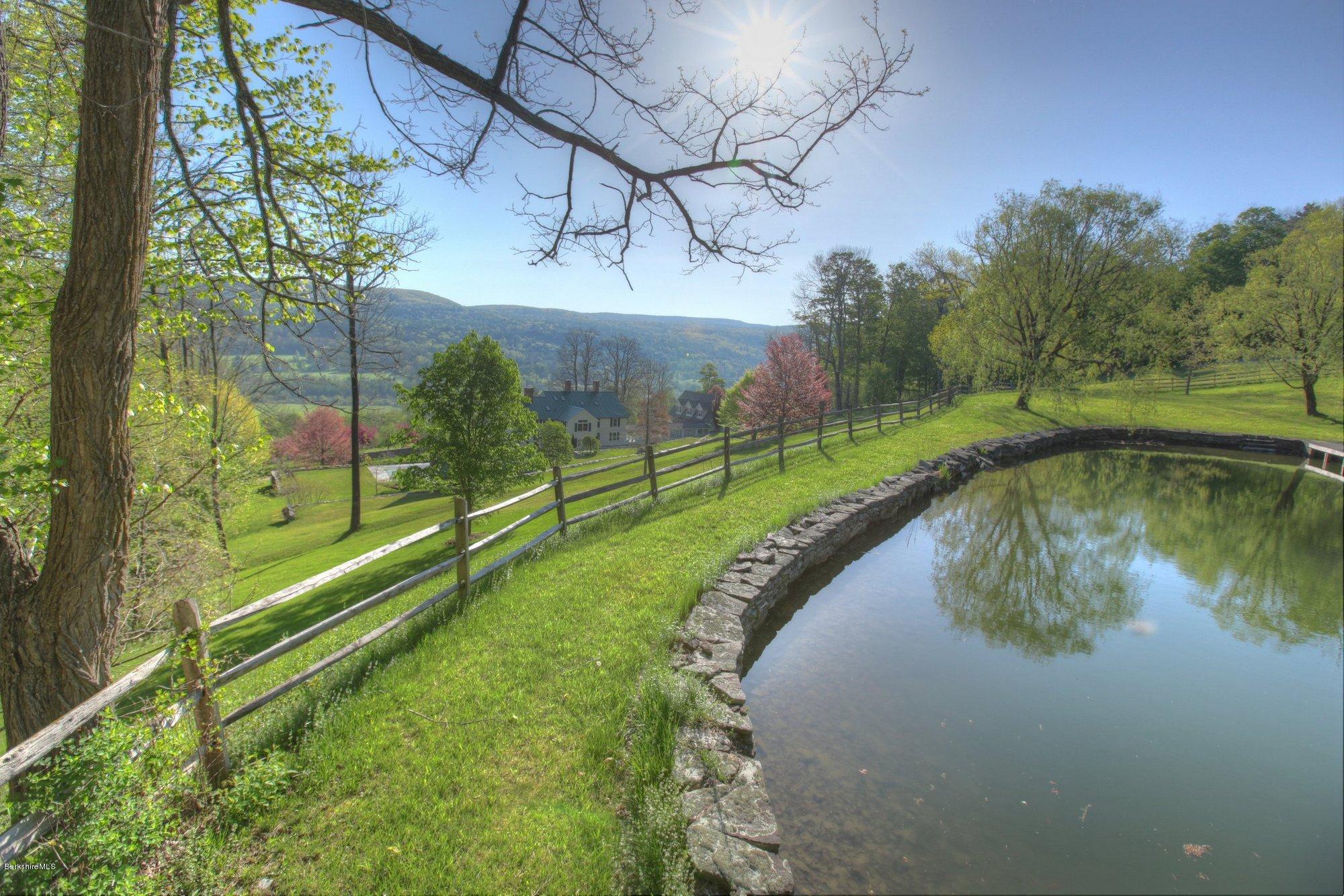 137 Jerusalem Road Tyringham, MA 01264 - Photo 7 of 59 a view of a lake in middle of the house