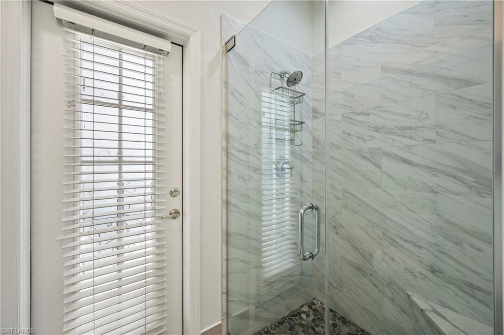 1742 Marsh Run Naples, FL 34109 - Photo 22 of 31 a bathroom with a shower