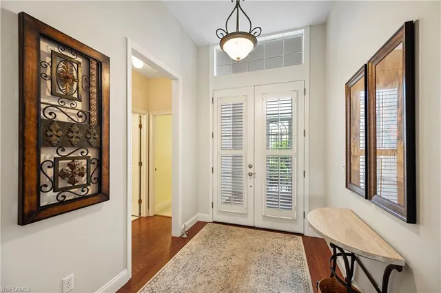 a view of a livingroom with furniture window and wooden floor