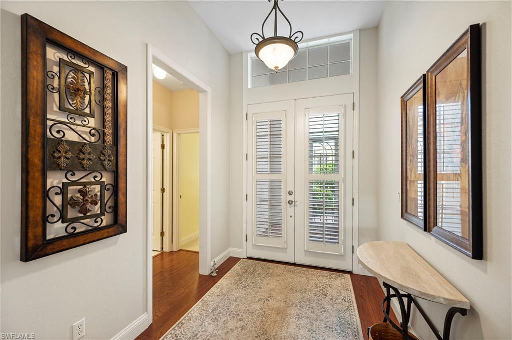 1742 Marsh Run Naples, FL 34109 - Photo 3 of 31 a view of a livingroom with furniture window and wooden floor