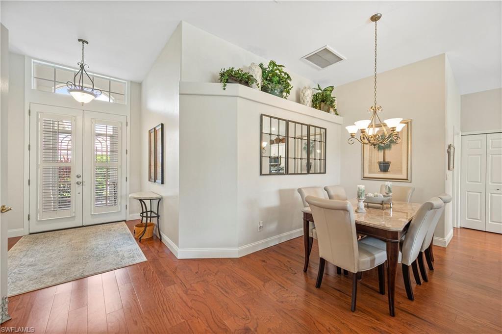 1742 Marsh Run Naples, FL 34109 - Photo 4 of 31 a view of a dining room with furniture window and wooden floor