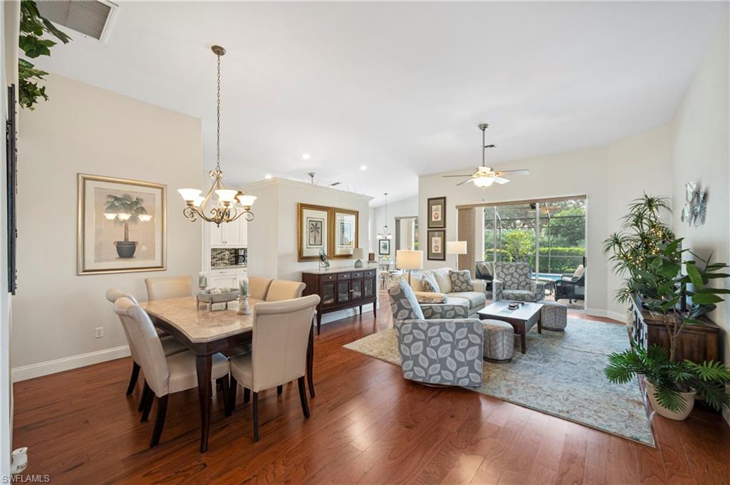 1742 Marsh Run Naples, FL 34109 - Photo 6 of 31 a view of a dining room with furniture window and wooden floor