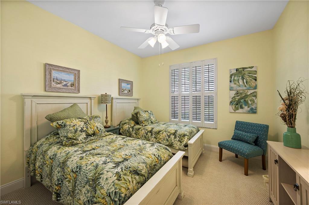 1742 Marsh Run Naples, FL 34109 - Photo 10 of 31 a bedroom with a bed and a couch