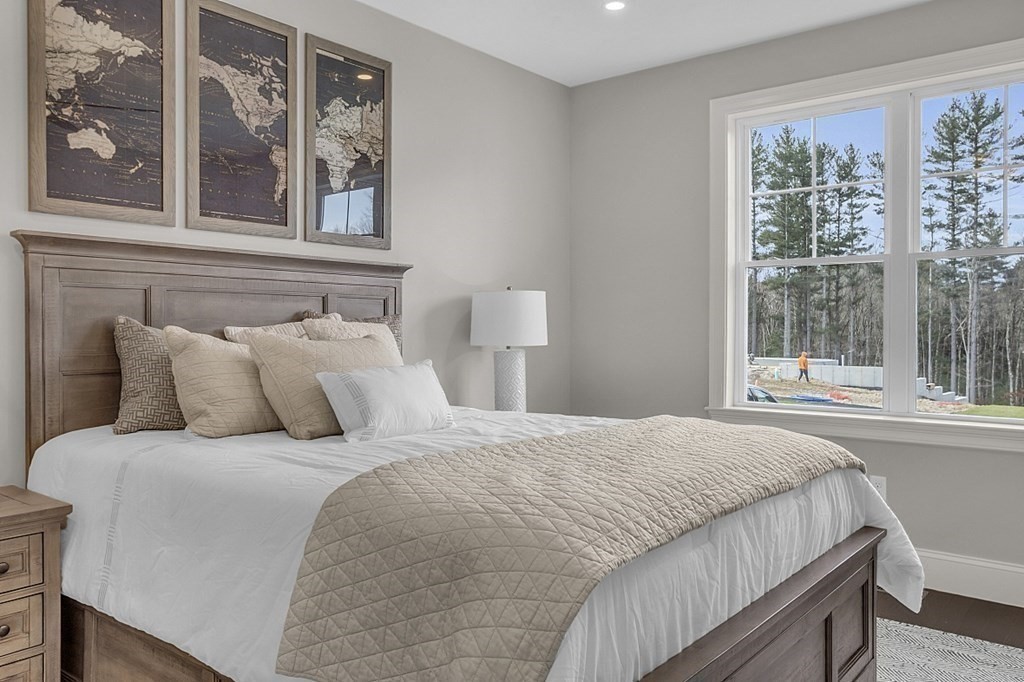 5 Boot Shop Road, Unit 31 Upton, MA 01568 - Photo 15 of 28 a bedroom with a large bed and a window