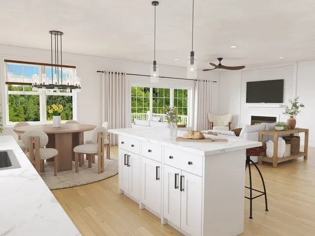 a view of a kitchen with kitchen island a large window in it