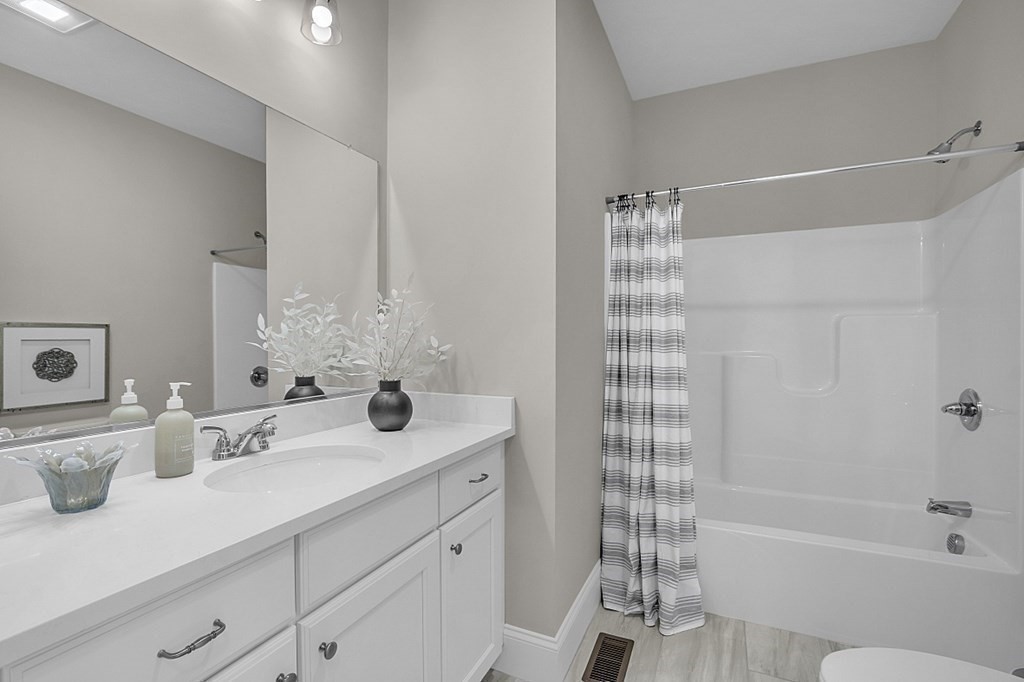 5 Boot Shop Road, Unit 31 Upton, MA 01568 - Photo 24 of 28 a bathroom with a sink double vanity and shower