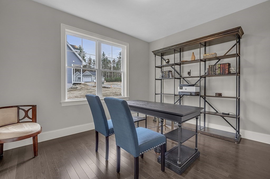 5 Boot Shop Road, Unit 31 Upton, MA 01568 - Photo 25 of 28 a view of a livingroom with furniture window and wooden floor