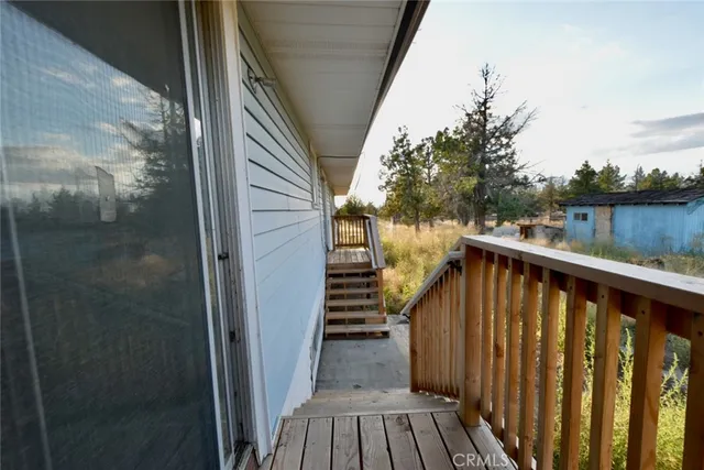 a view of balcony with wooden floor