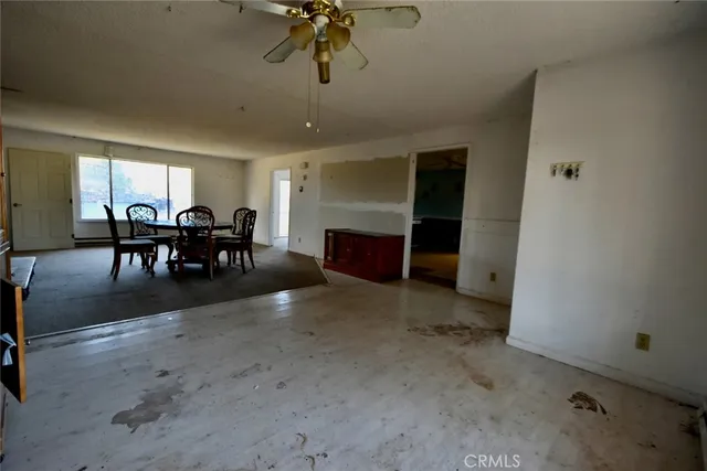 a view of a livingroom with furniture and chandelier