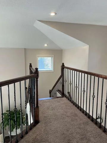 a bedroom with two beds and a chandelier