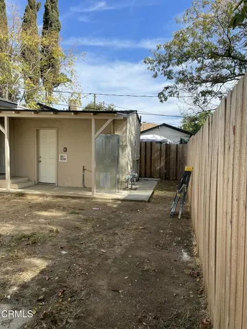 a view of a house with a tree