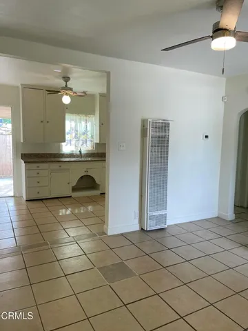 a bathroom with a granite countertop sink a mirror and a shower