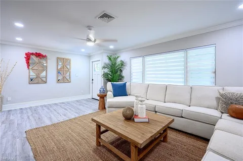 a living room with furniture and a rug