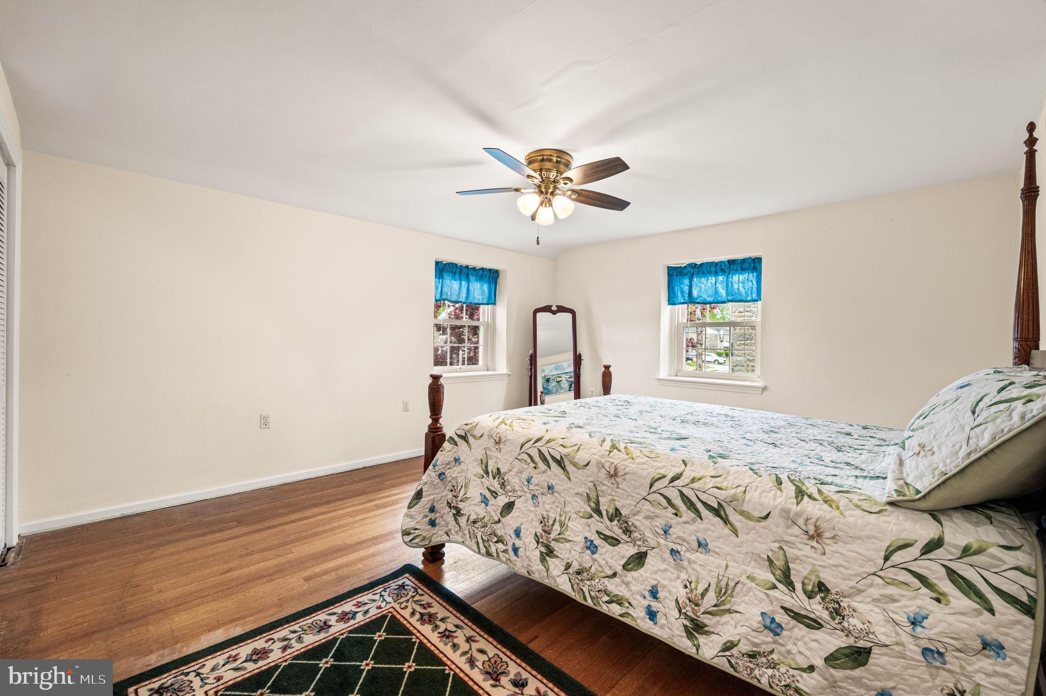 481 Maplewood Road Springfield, PA 19064 - Photo 17 of 31 a bedroom with a bed and a chandelier