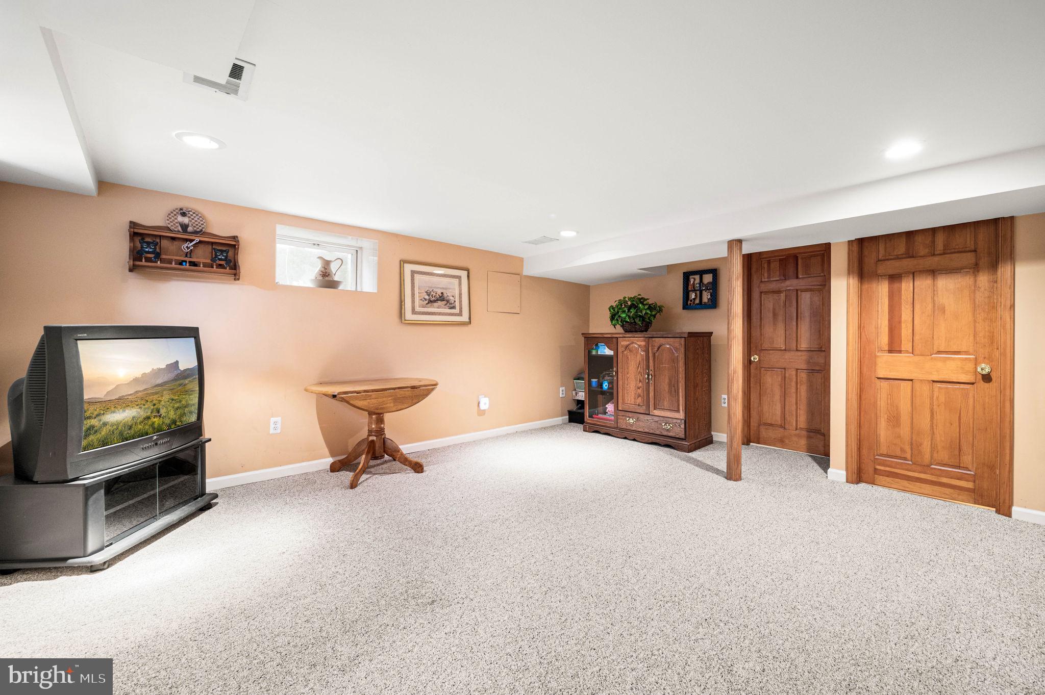 481 Maplewood Road Springfield, PA 19064 - Photo 23 of 31 a living room with furniture and a flat screen tv