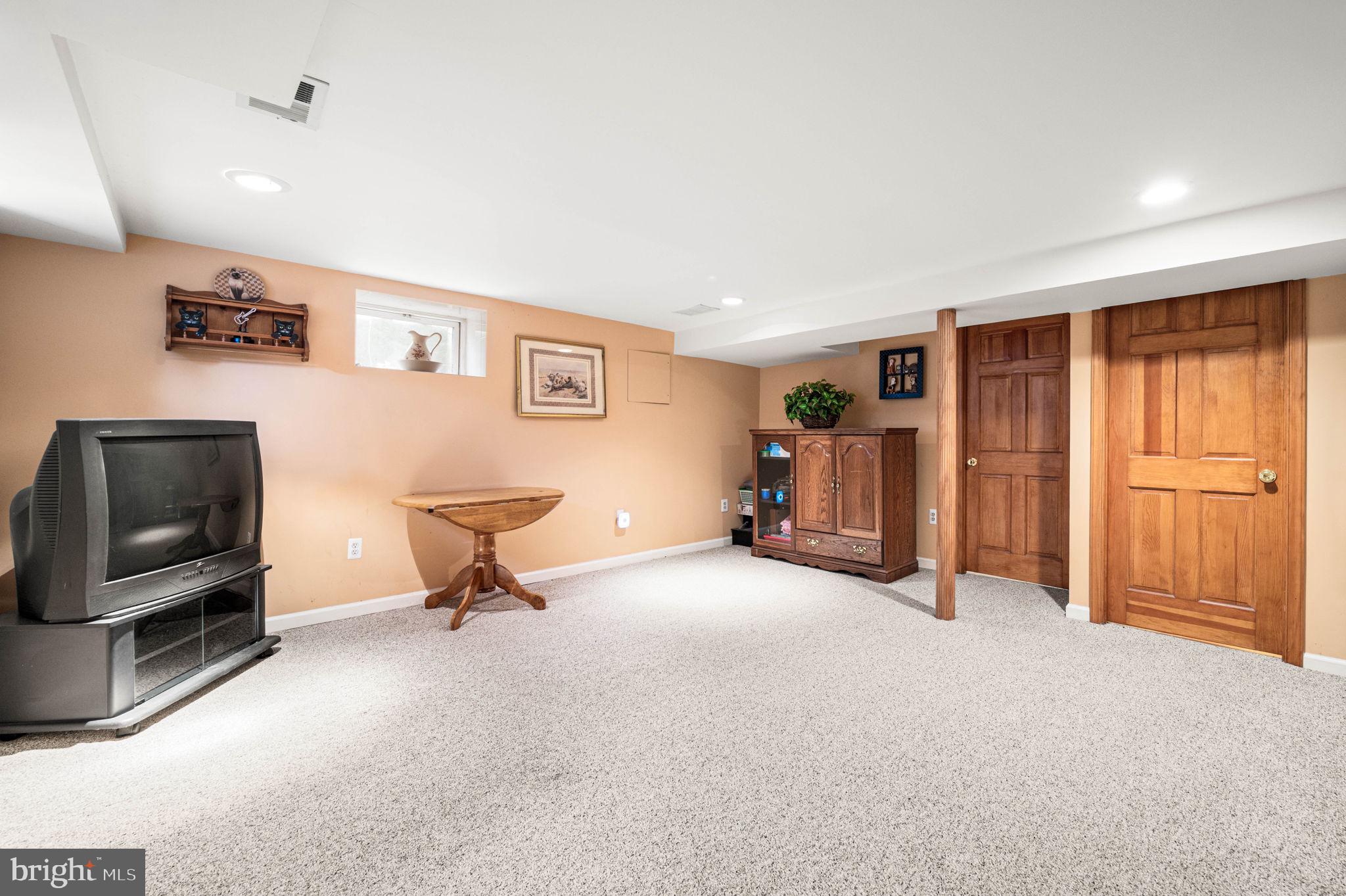 481 Maplewood Road Springfield, PA 19064 - Photo 24 of 31 a living room with furniture and a flat screen tv