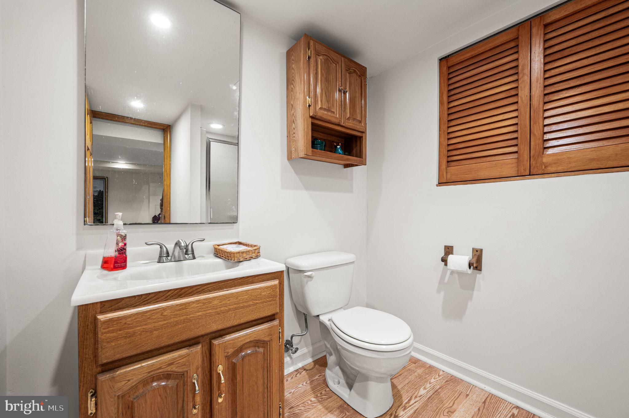 481 Maplewood Road Springfield, PA 19064 - Photo 25 of 31 a bathroom with a toilet sink and mirror