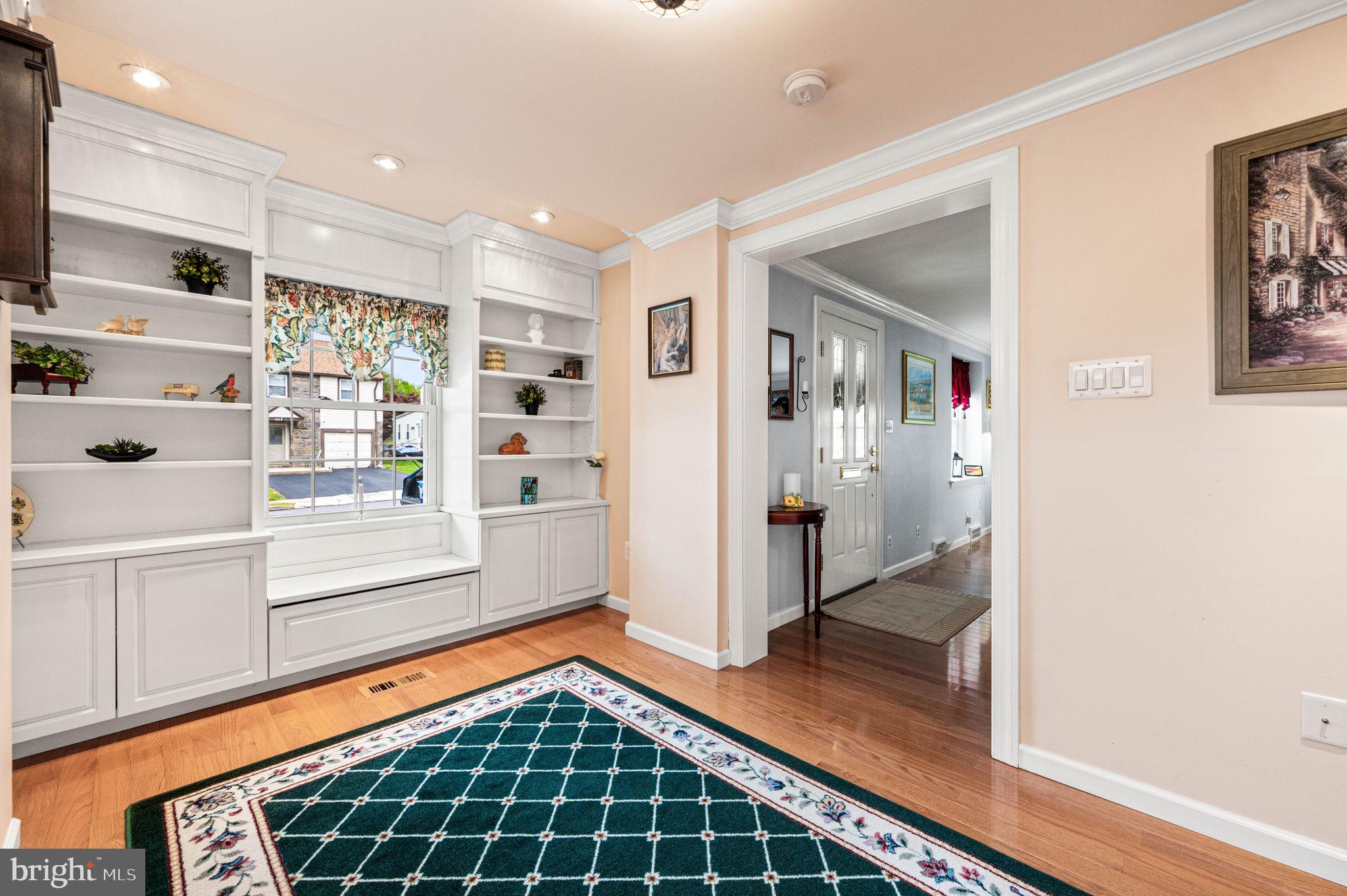 481 Maplewood Road Springfield, PA 19064 - Photo 6 of 31 a view of a hallway with wooden floor and windows