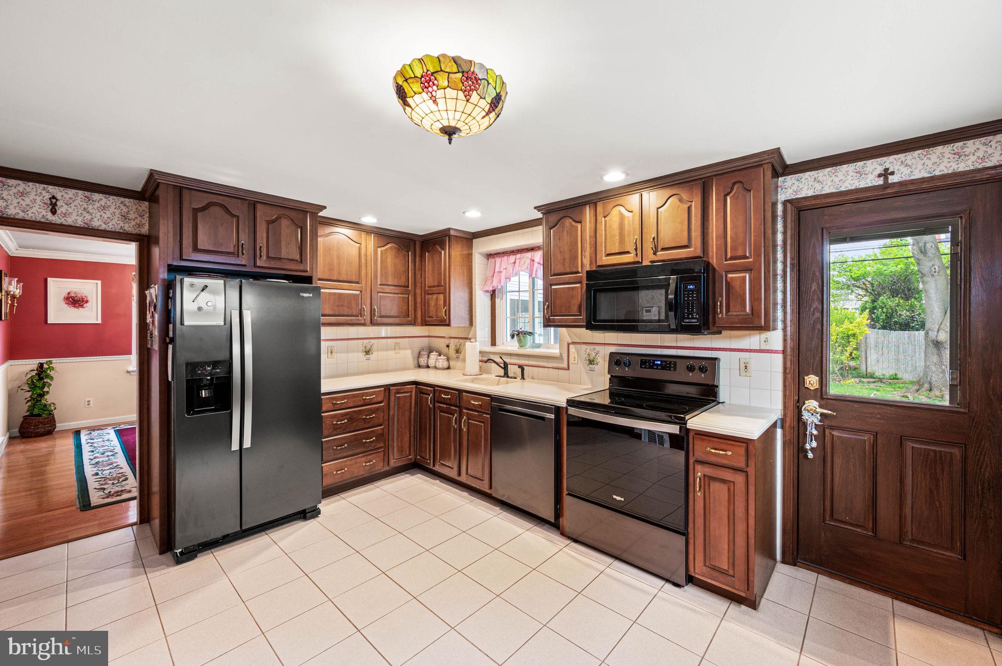 481 Maplewood Road Springfield, PA 19064 - Photo 10 of 31 a kitchen with stainless steel appliances granite countertop a refrigerator and a stove top oven