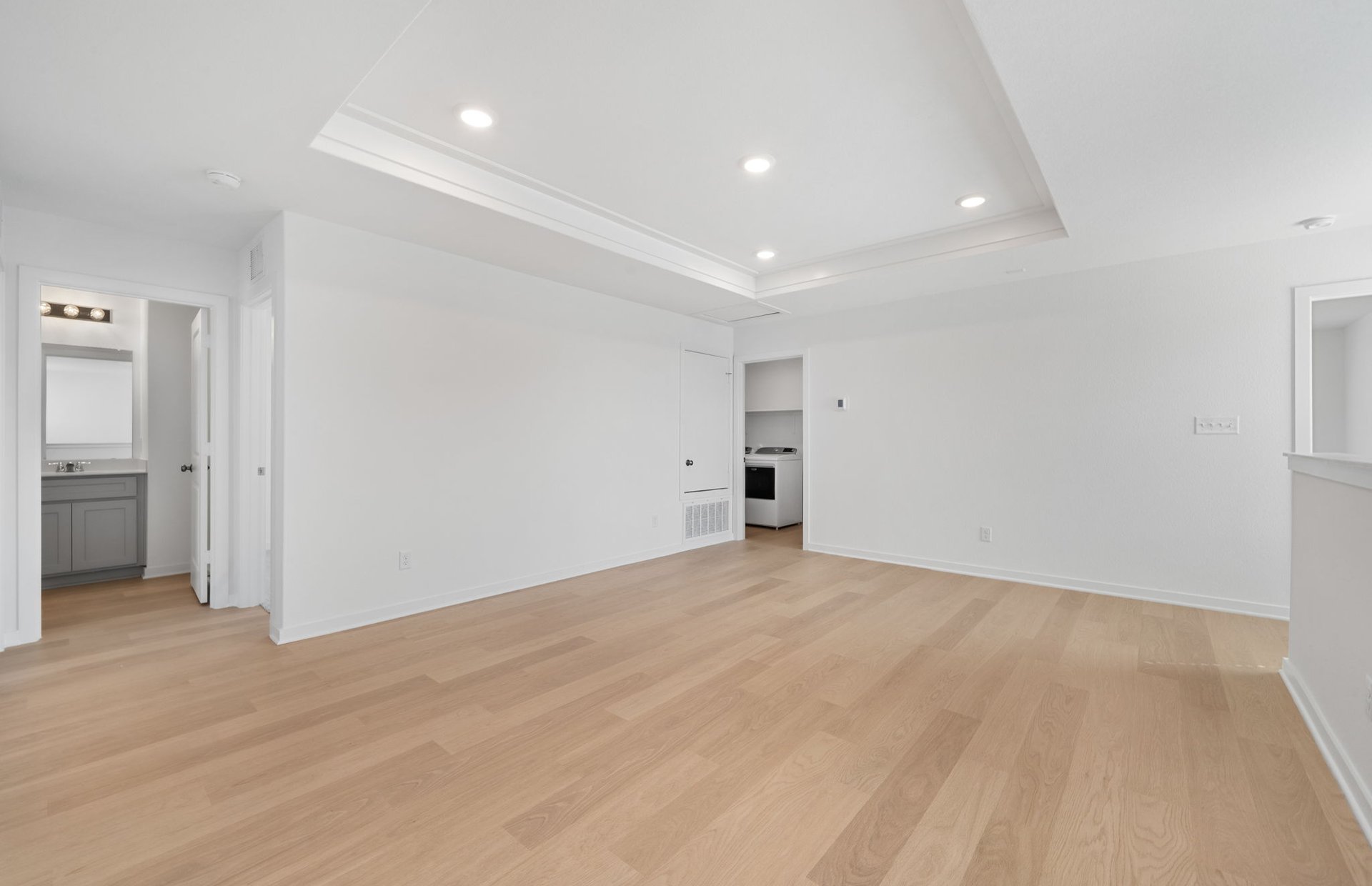 608 Rubber Tree Way Buda, TX 78610 - Photo 17 of 29 a view of empty room with wooden floor