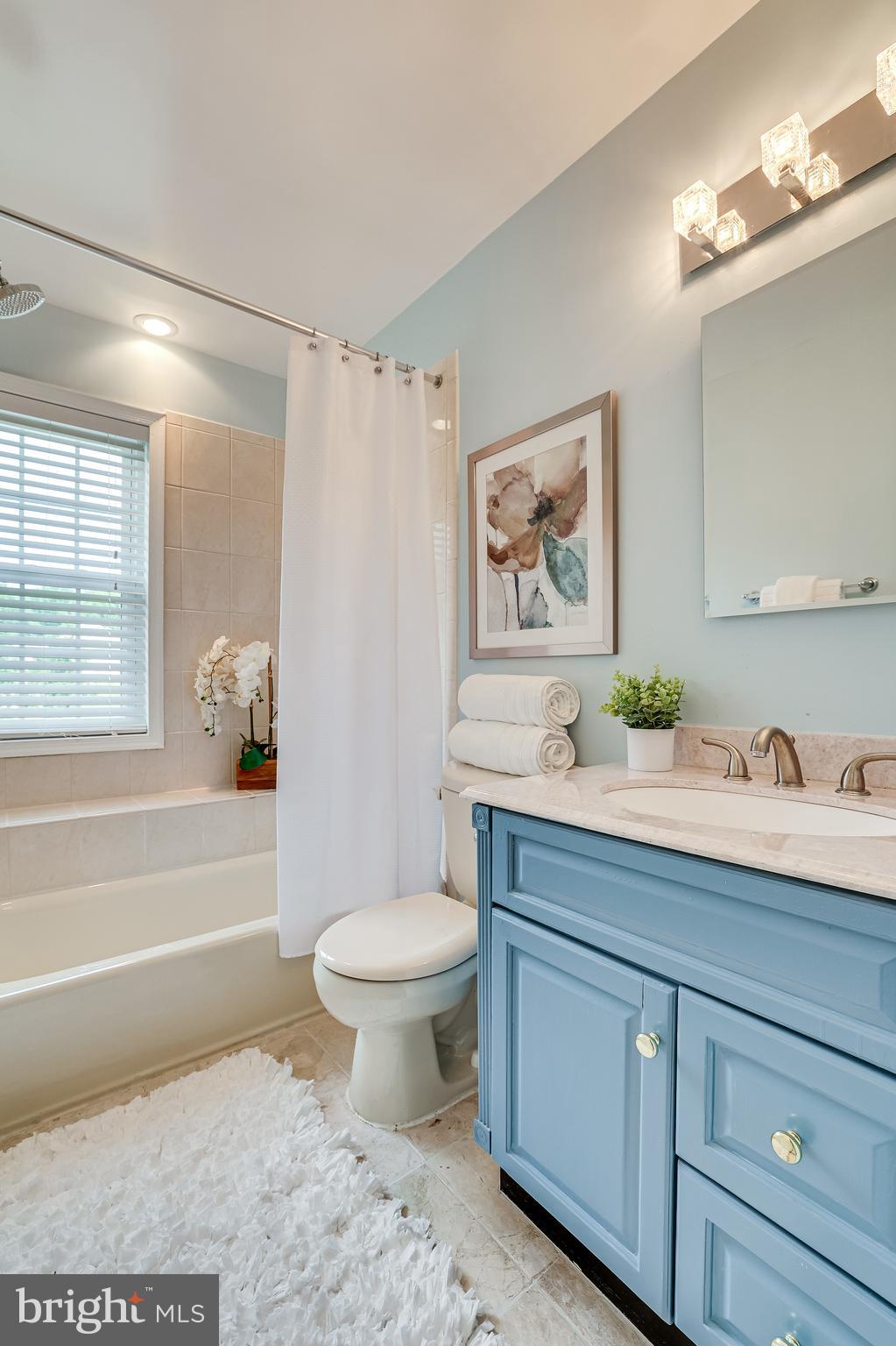 11962 Sentinel Point Court Reston, VA 20191 - Photo 36 of 62 The primary bath has a ceramic tile shower/tub.