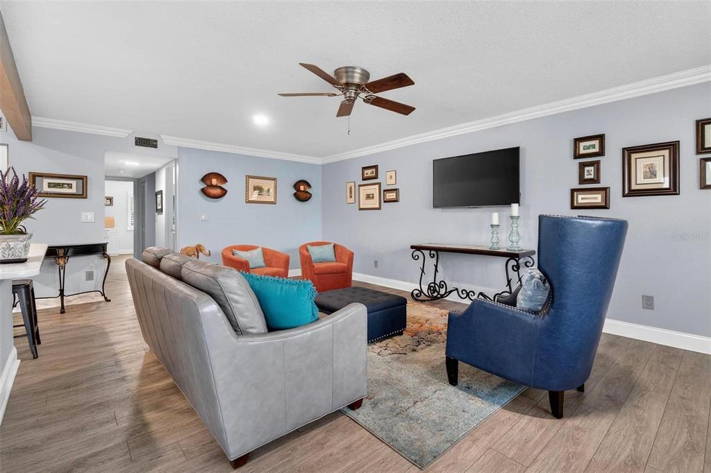 2811 Rampart Circle, Unit 2811 Clearwater, FL 33761 - Photo 14 of 30 a living room with furniture and a flat screen tv