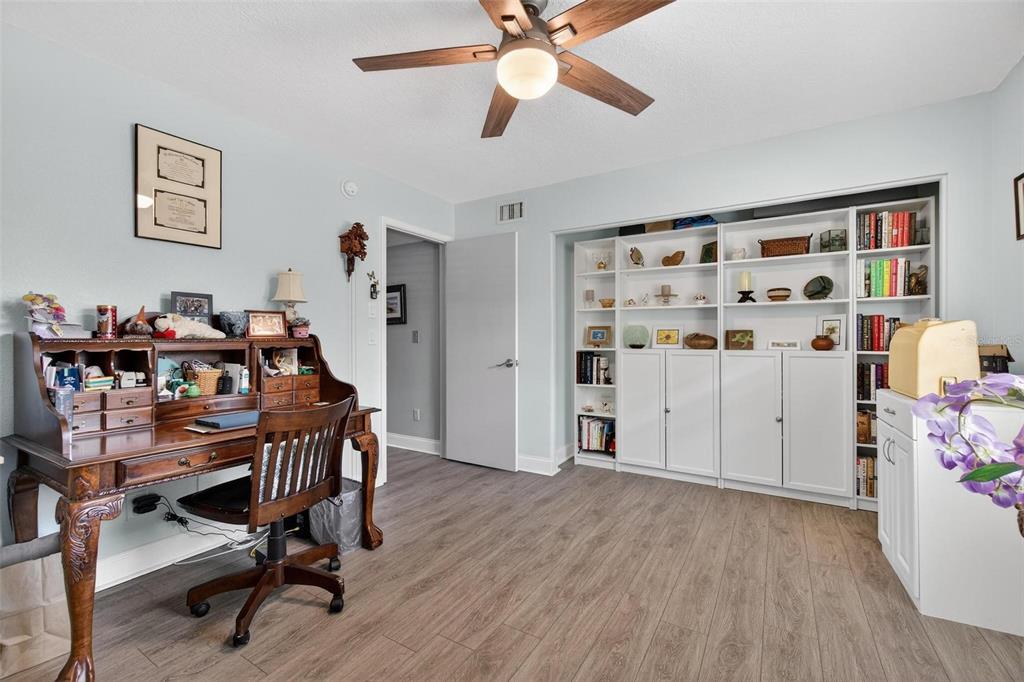 2811 Rampart Circle, Unit 2811 Clearwater, FL 33761 - Photo 18 of 30 a view of a workspace with furniture and wooden floor