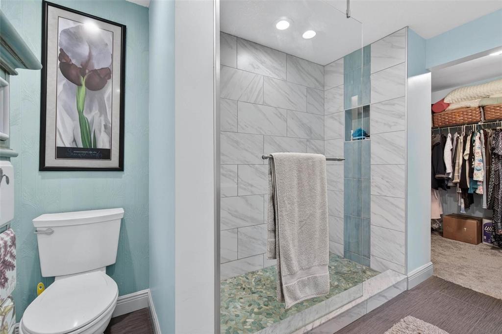 2811 Rampart Circle, Unit 2811 Clearwater, FL 33761 - Photo 27 of 30 a bathroom with a toilet sink and shower