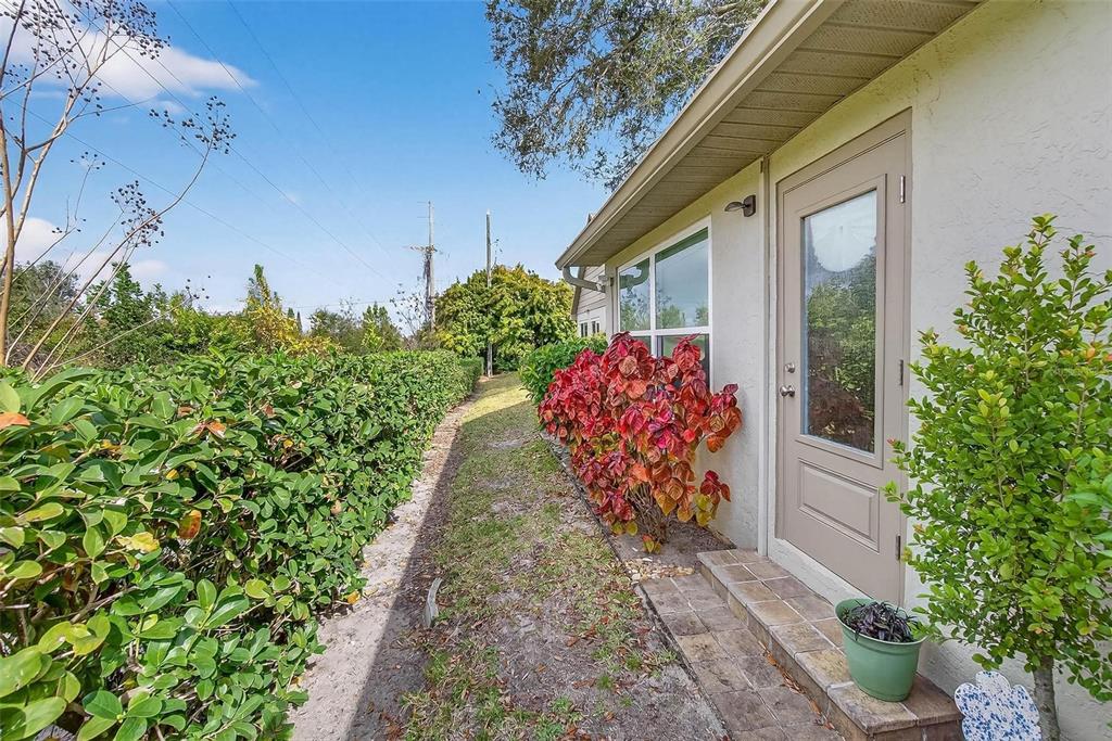 2811 Rampart Circle, Unit 2811 Clearwater, FL 33761 - Photo 3 of 30 a front view of a house with a yard