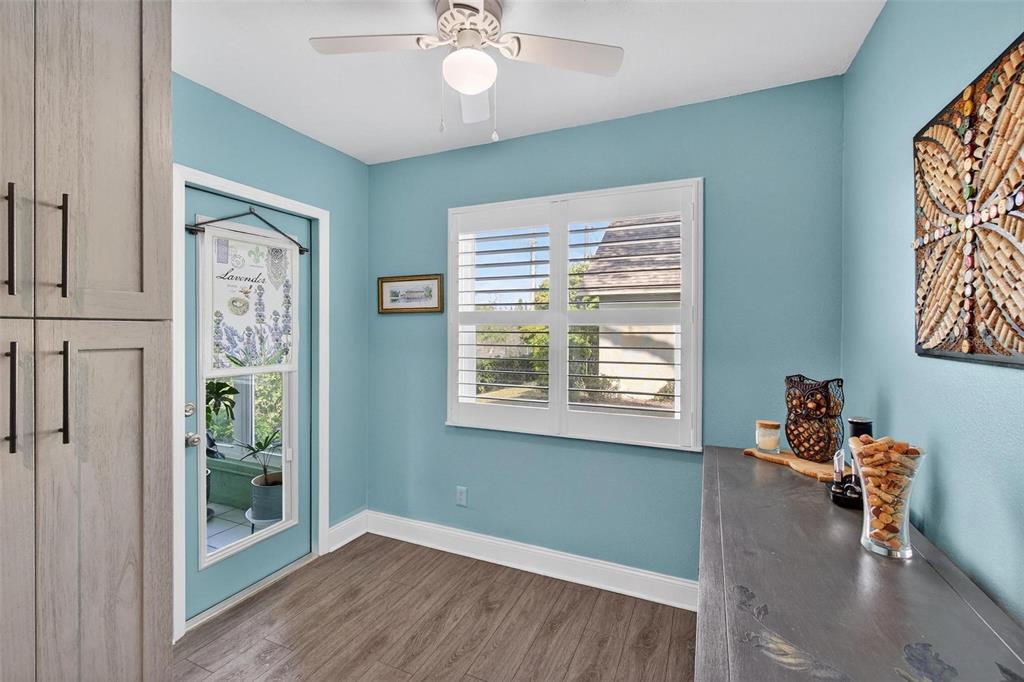 2811 Rampart Circle, Unit 2811 Clearwater, FL 33761 - Photo 8 of 30 a view of an empty room with window and wooden floor