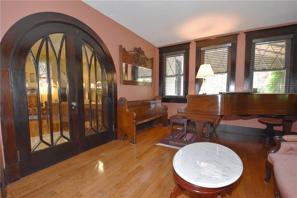 3325 Brownsville Road Pittsburgh, PA 15227 - Photo 16 of 30 a living room with furniture a large window and wooden floor