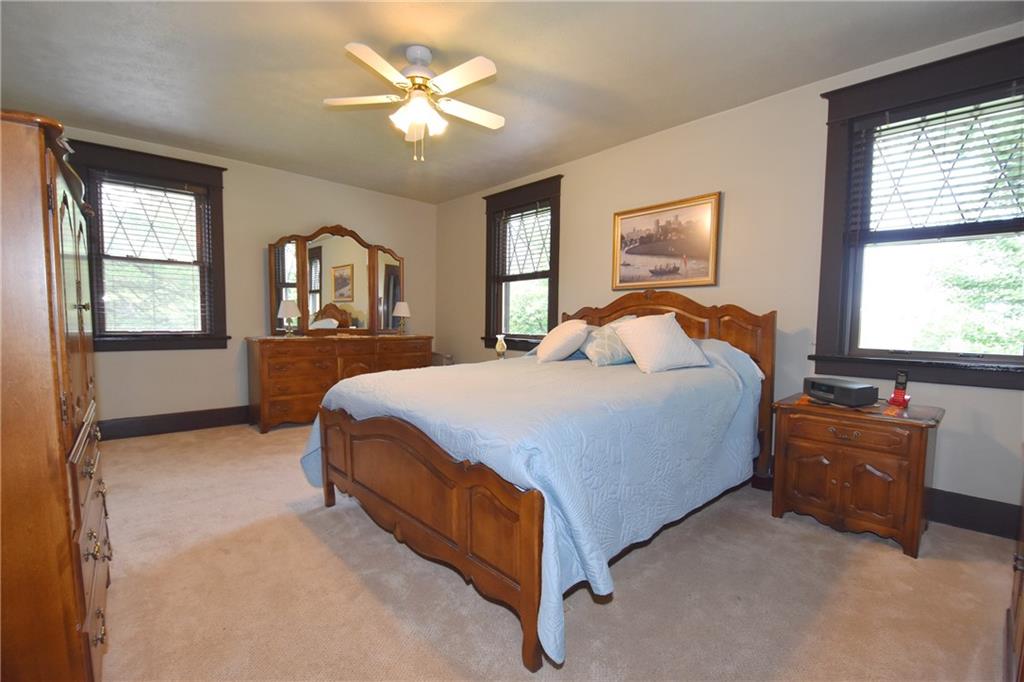 3325 Brownsville Road Pittsburgh, PA 15227 - Photo 17 of 30 a bedroom with a bed dresser and a window