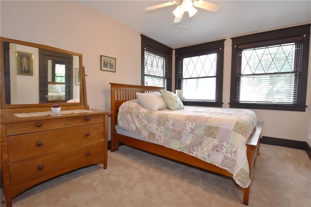 3325 Brownsville Road Pittsburgh, PA 15227 - Photo 19 of 30 a bedroom with a bed and a large window