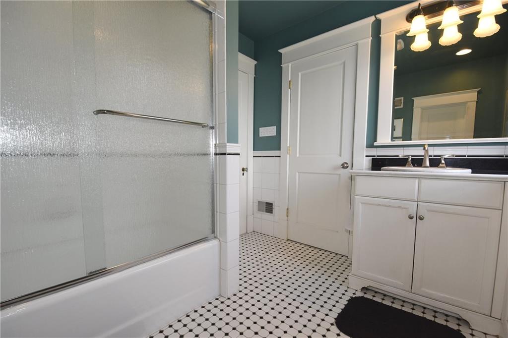 3325 Brownsville Road Pittsburgh, PA 15227 - Photo 21 of 30 a bathroom with a sink a toilet and shower