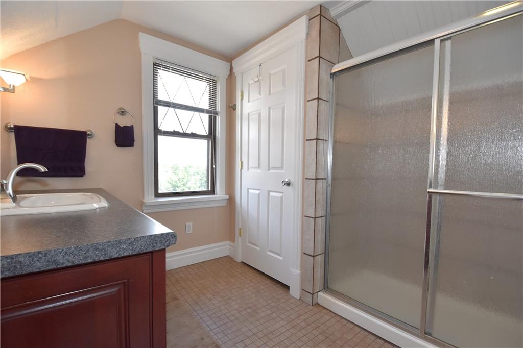 3325 Brownsville Road Pittsburgh, PA 15227 - Photo 23 of 30 a bathroom with a granite countertop sink mirror and shower