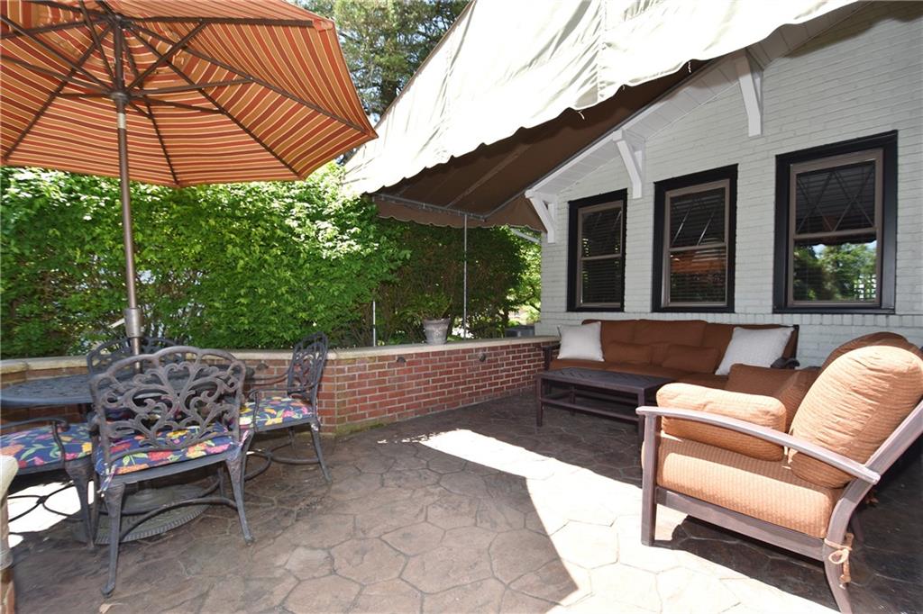 3325 Brownsville Road Pittsburgh, PA 15227 - Photo 24 of 30 a view of a patio with a table and chairs under an umbrella