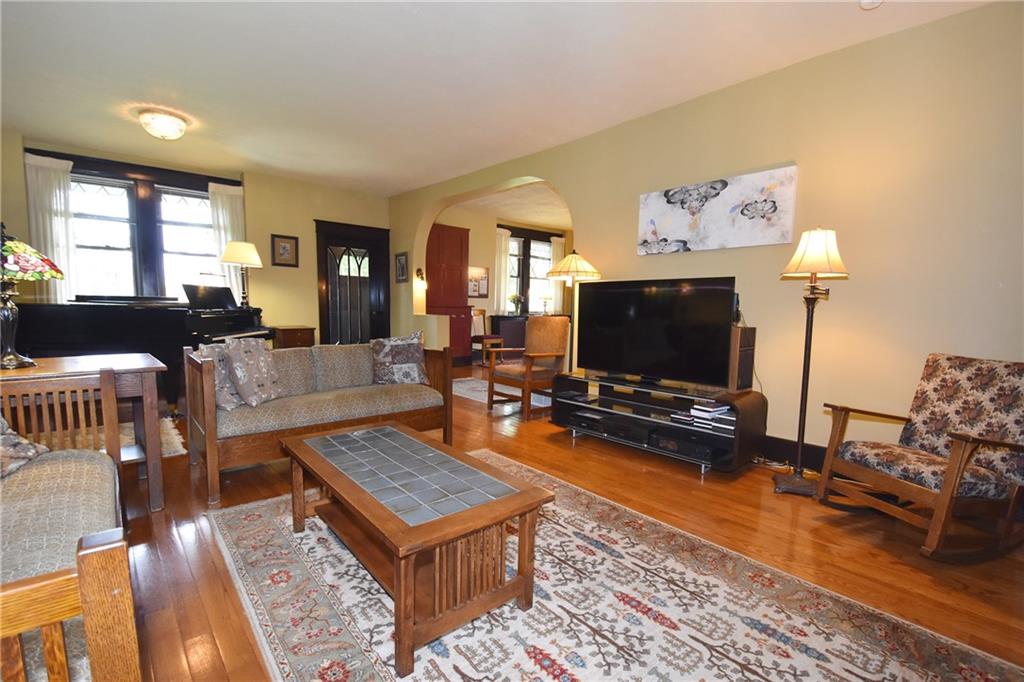 3325 Brownsville Road Pittsburgh, PA 15227 - Photo 8 of 30 a living room with furniture and a flat screen tv