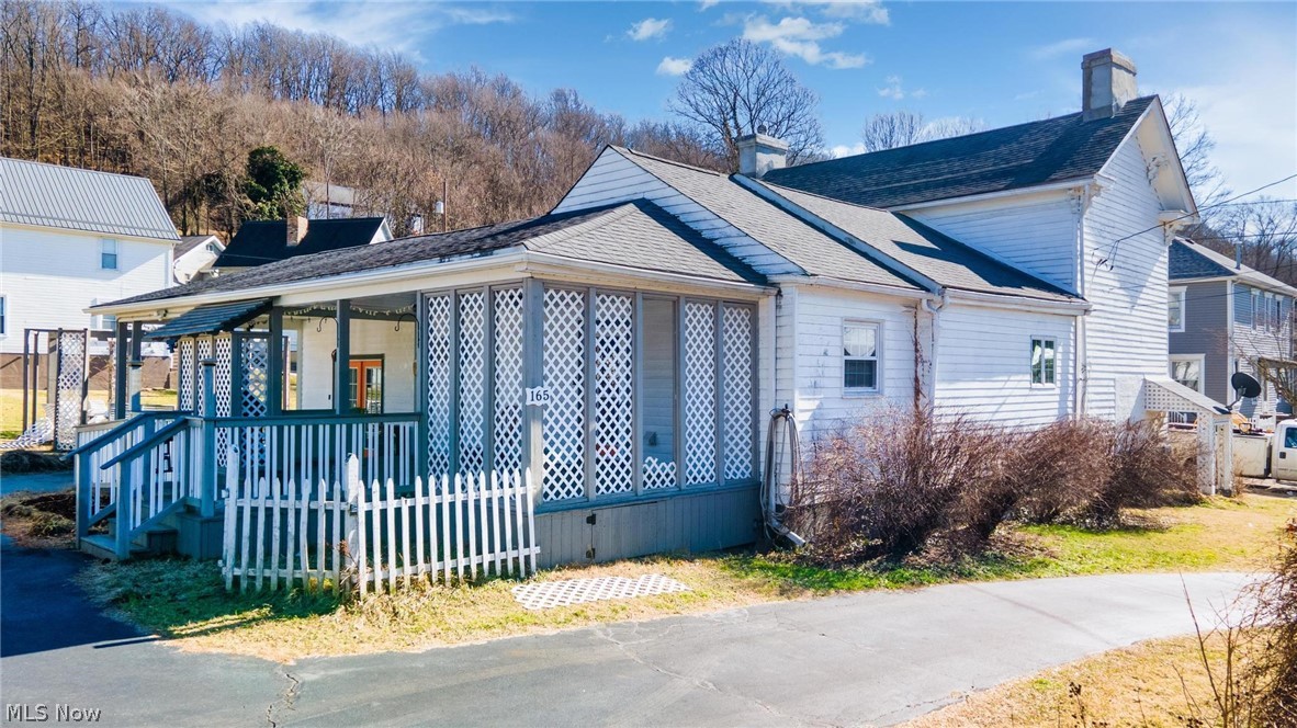 165 9th Street Wellsburg, WV 26070 - Photo 4 of 37 View of side of home featuring a chimney and a porch