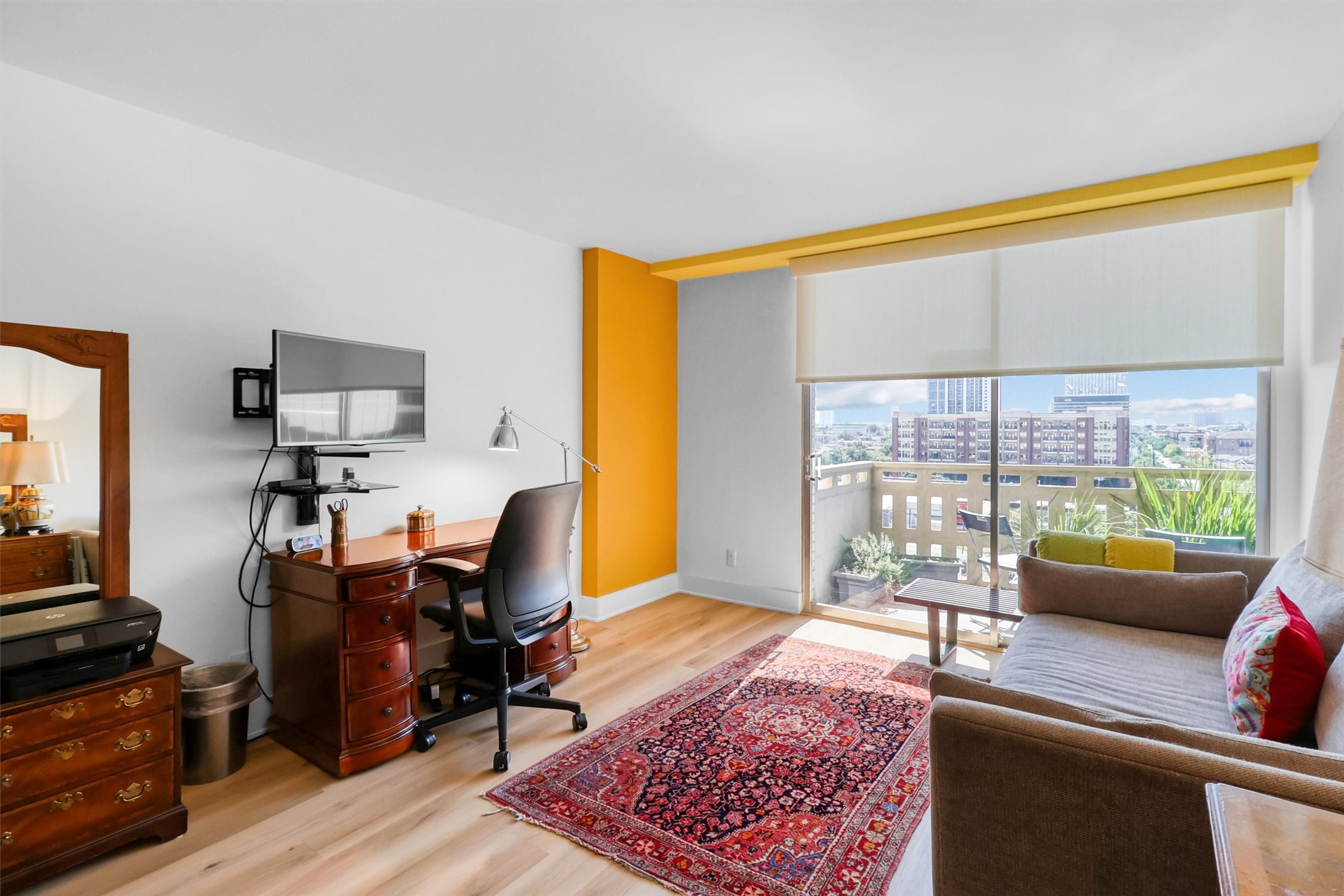 2016 Main Street, Unit 722 Houston, TX 77002 - Photo 21 of 38 a living room with furniture and a flat screen tv