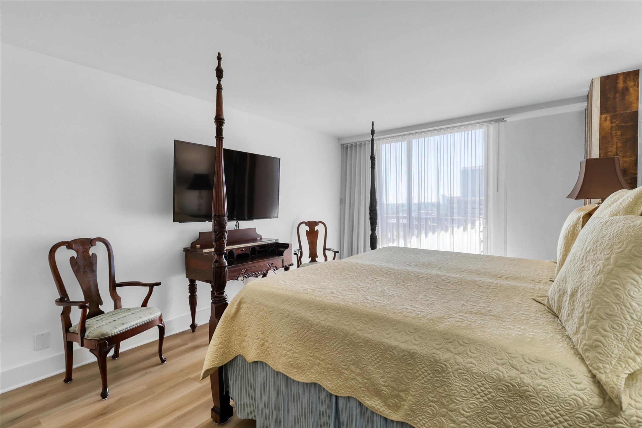 2016 Main Street, Unit 722 Houston, TX 77002 - Photo 26 of 38 a bedroom with furniture and a window