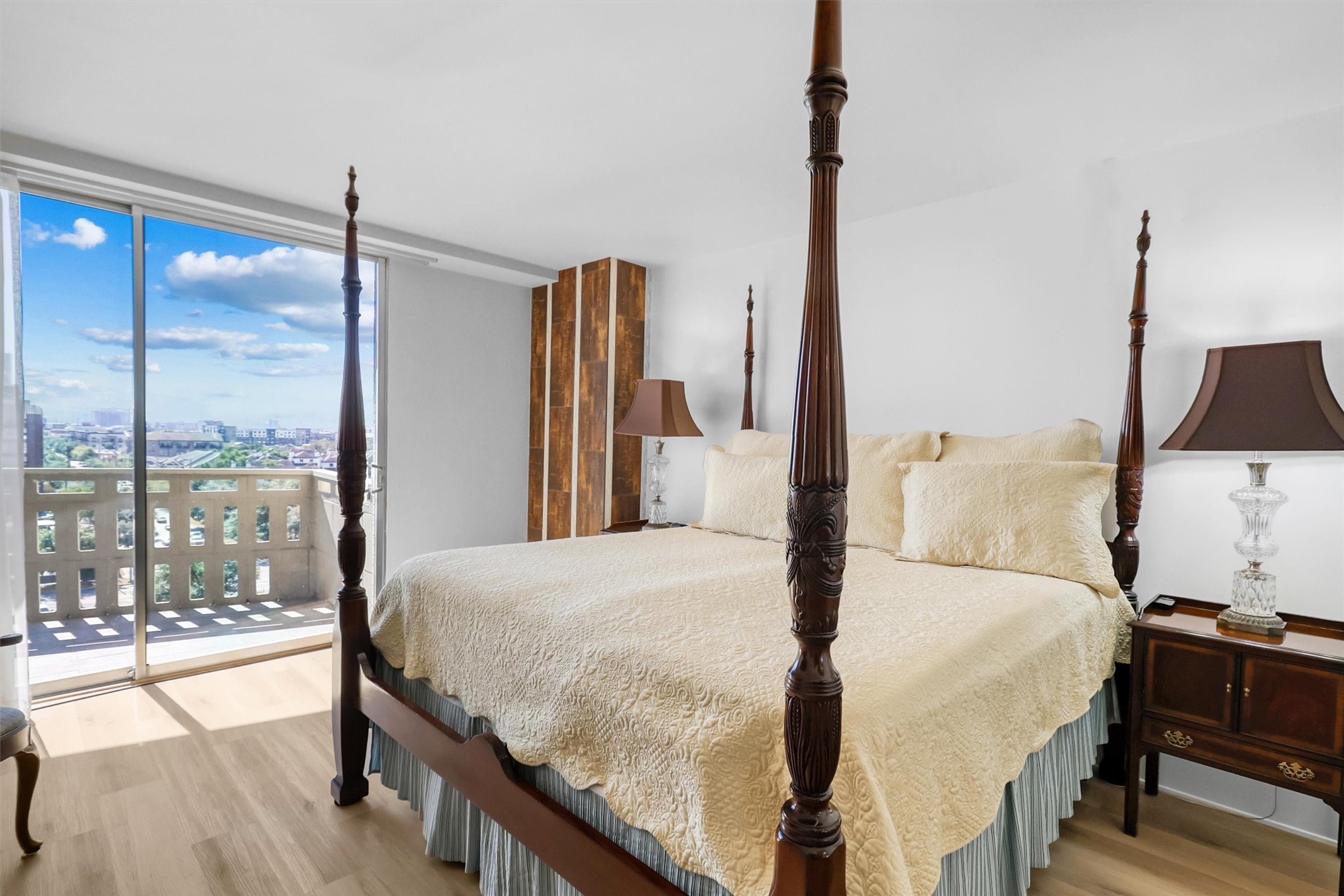 2016 Main Street, Unit 722 Houston, TX 77002 - Photo 27 of 38 a bedroom with a large bed and a chandelier