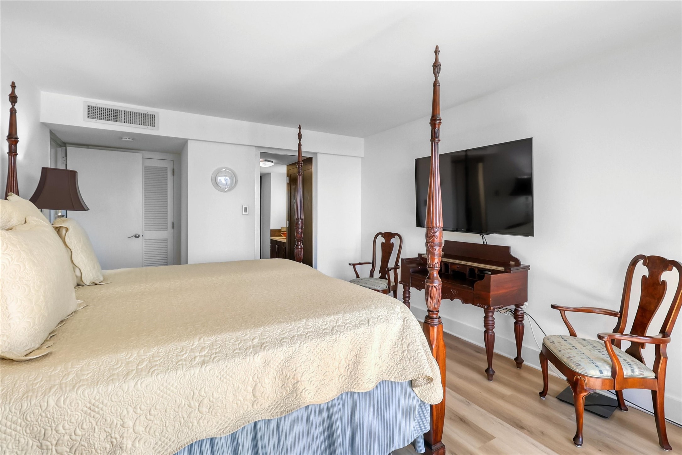 2016 Main Street, Unit 722 Houston, TX 77002 - Photo 28 of 38 a bedroom with a bed tv and chair