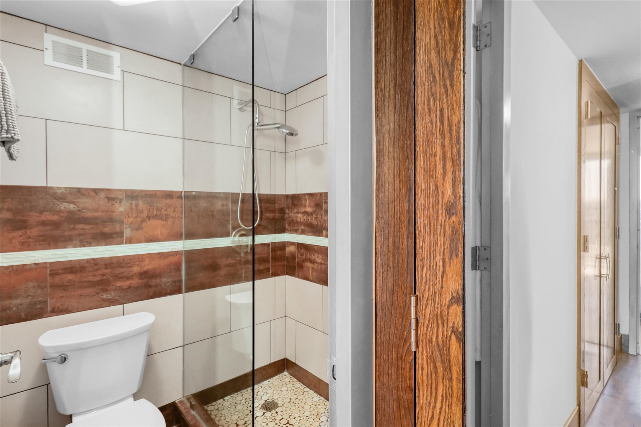 2016 Main Street, Unit 722 Houston, TX 77002 - Photo 31 of 38 a bathroom with a toilet and shower