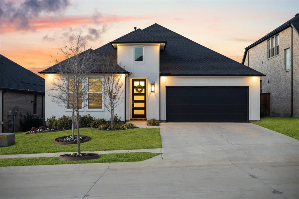 1517 Miranda Lane Denton, TX 76210 - Photo 2 of 37 a front view of a house with a yard