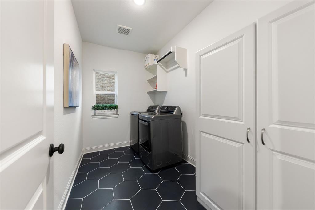 1517 Miranda Lane Denton, TX 76210 - Photo 22 of 37 a view of a storage & utility room with a sink