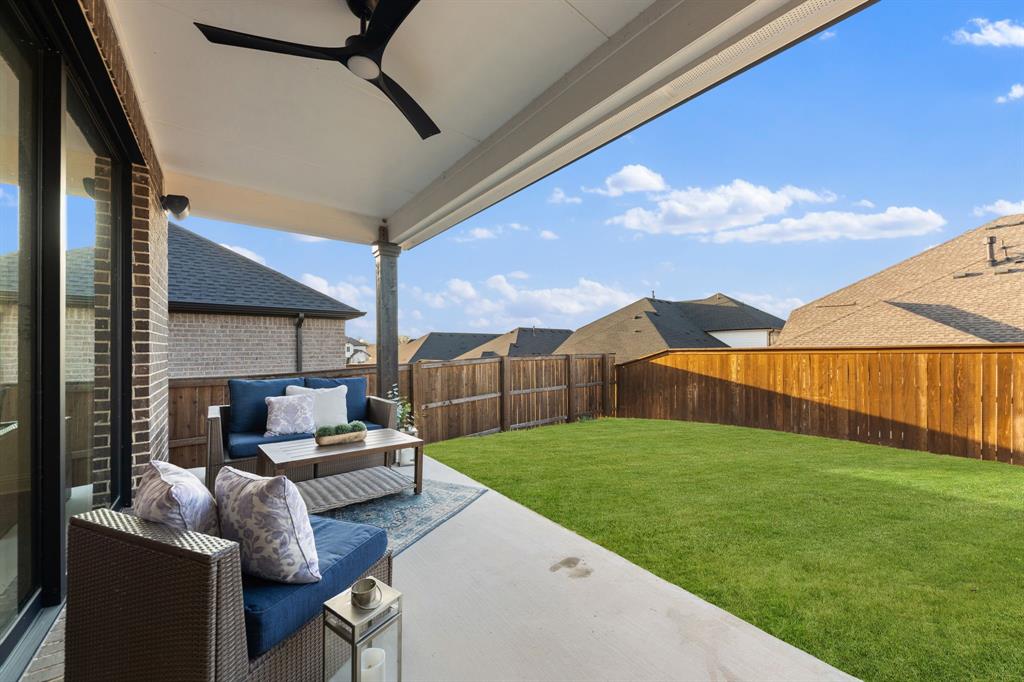 1517 Miranda Lane Denton, TX 76210 - Photo 23 of 37 a backyard of a house with table and chairs