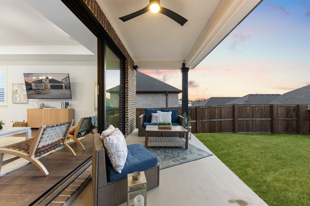 1517 Miranda Lane Denton, TX 76210 - Photo 25 of 37 a living room with furniture and a fireplace