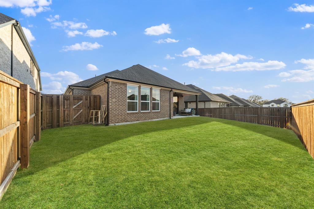 1517 Miranda Lane Denton, TX 76210 - Photo 27 of 37 a view of a house with backyard and garden