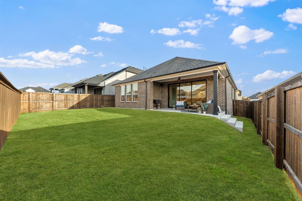 1517 Miranda Lane Denton, TX 76210 - Photo 28 of 37 a view of house that has a yard