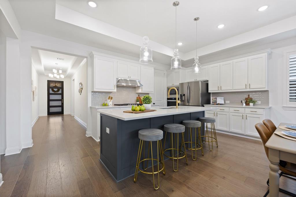 1517 Miranda Lane Denton, TX 76210 - Photo 6 of 37 a kitchen with granite countertop a counter space a sink appliances and cabinets